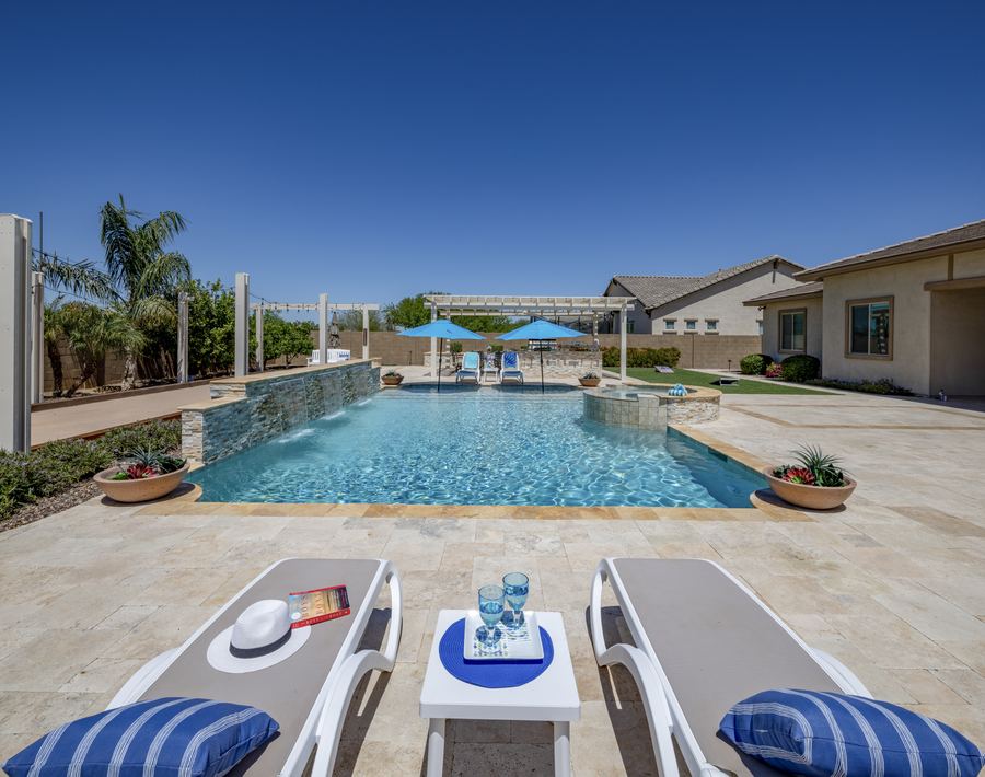 Pool with sheer descents and loungers