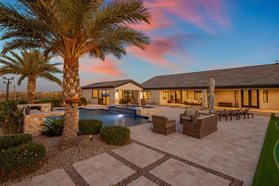 Pool and spa framed by palms at sunset, Legacy Living in San Tan Valley, AZ