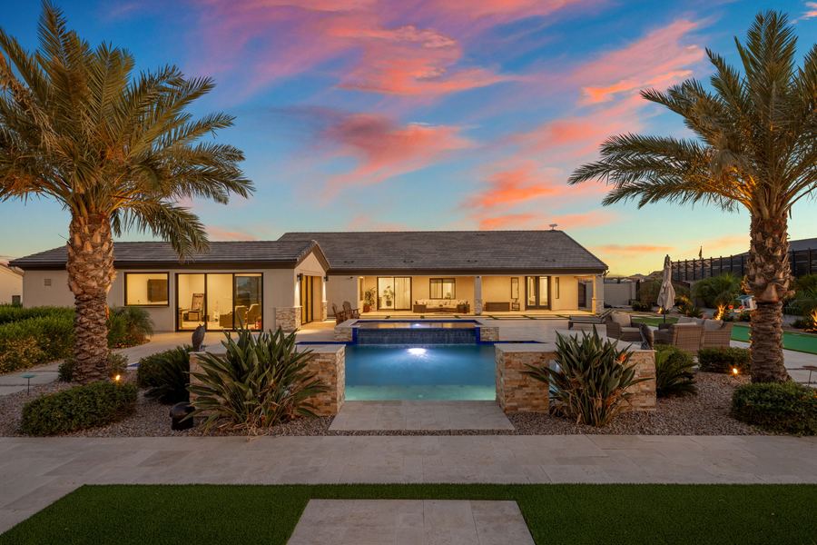 Raised spa spillover and lawn at sunset