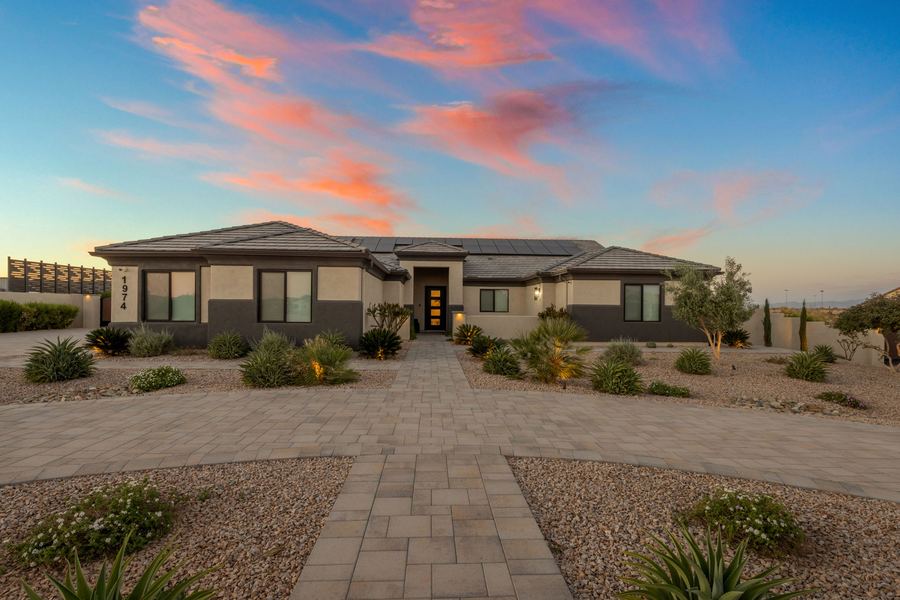 Front walkway and landscaping at dusk