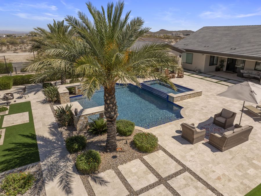 Aerial view of a palm over the pool, spa and lounge seating