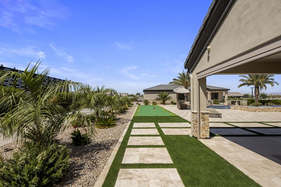 Stepping pavers set in turf along the covered patio