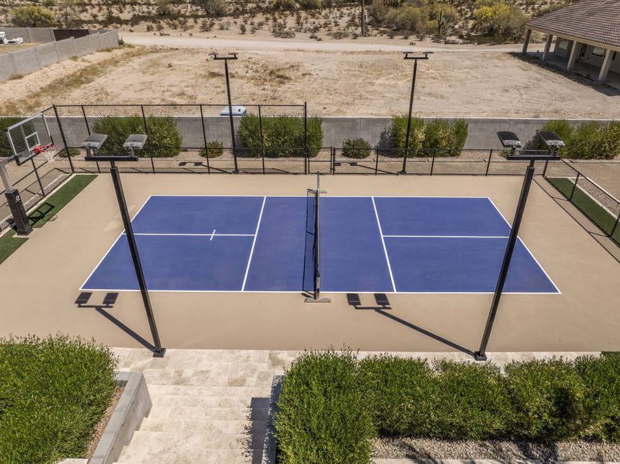 Pickleball court with lights and fencing