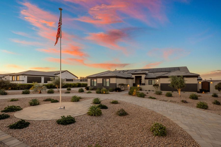 Flagpole on a paver circle in the front yard at sunset