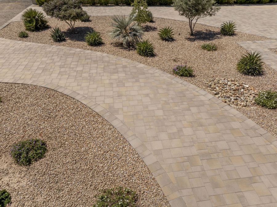 Curved paver drive through desert landscaping
