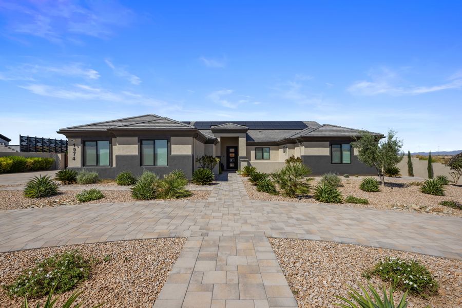Paver walkway to the front entry through desert landscaping