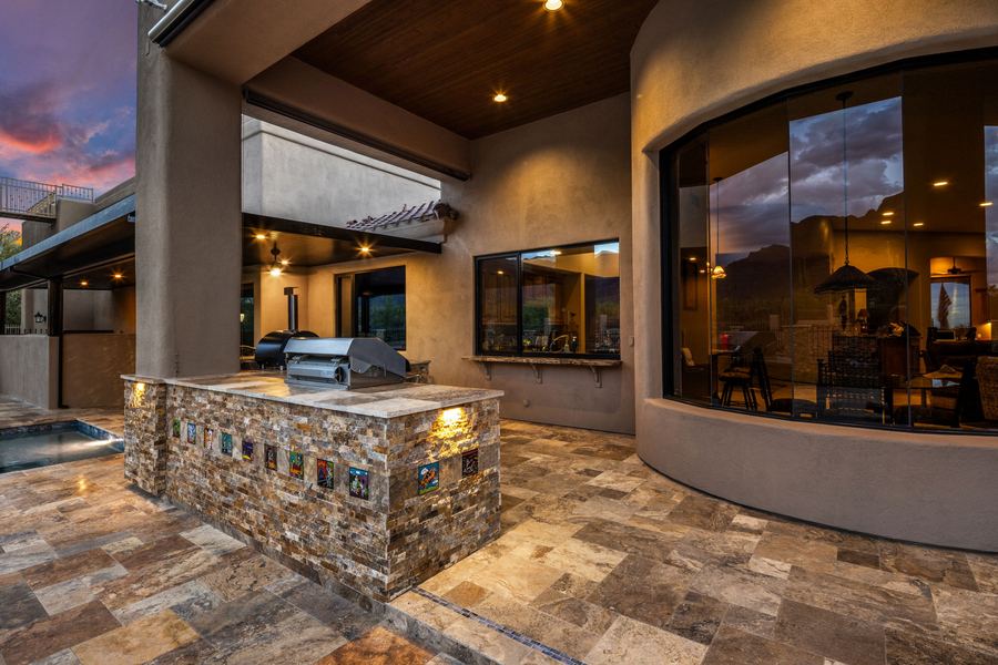 Outdoor kitchen wrapped in stacked stone