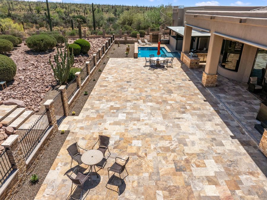 Aerial of the long travertine patio with dining set