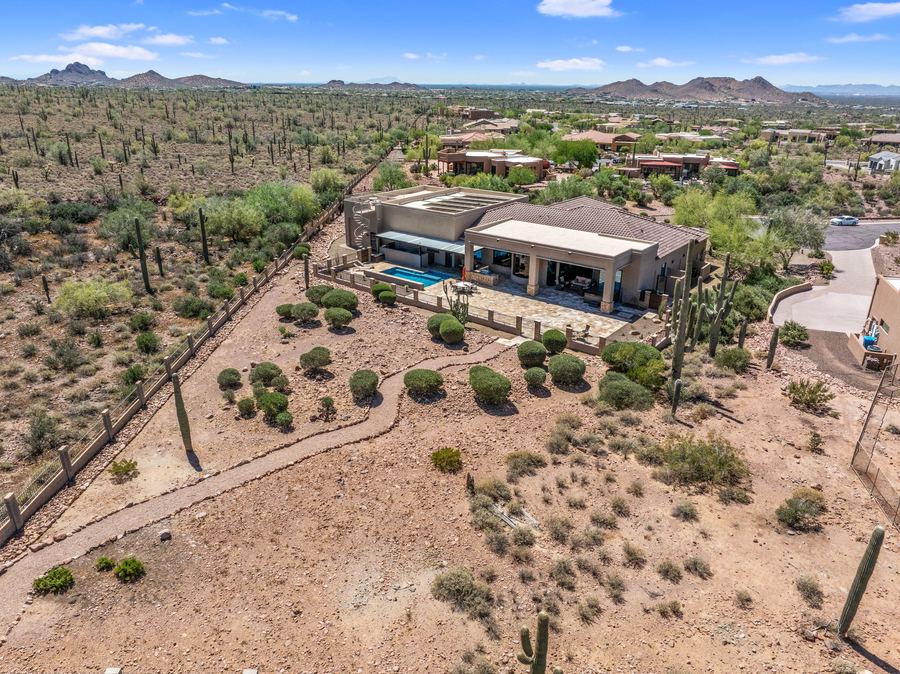 High aerial of the home and surrounding desert
