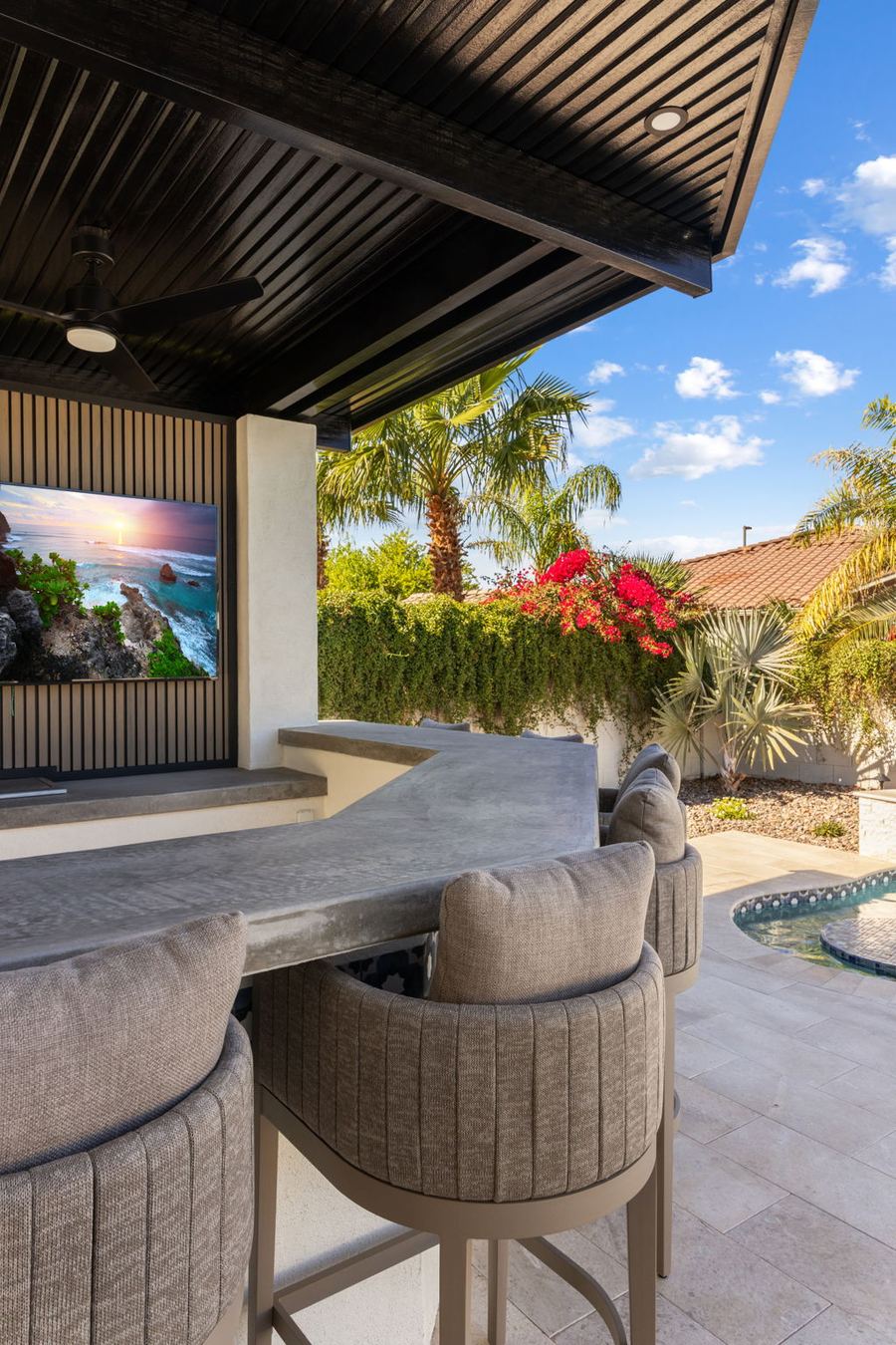 Upholstered bar stools at the covered outdoor bar